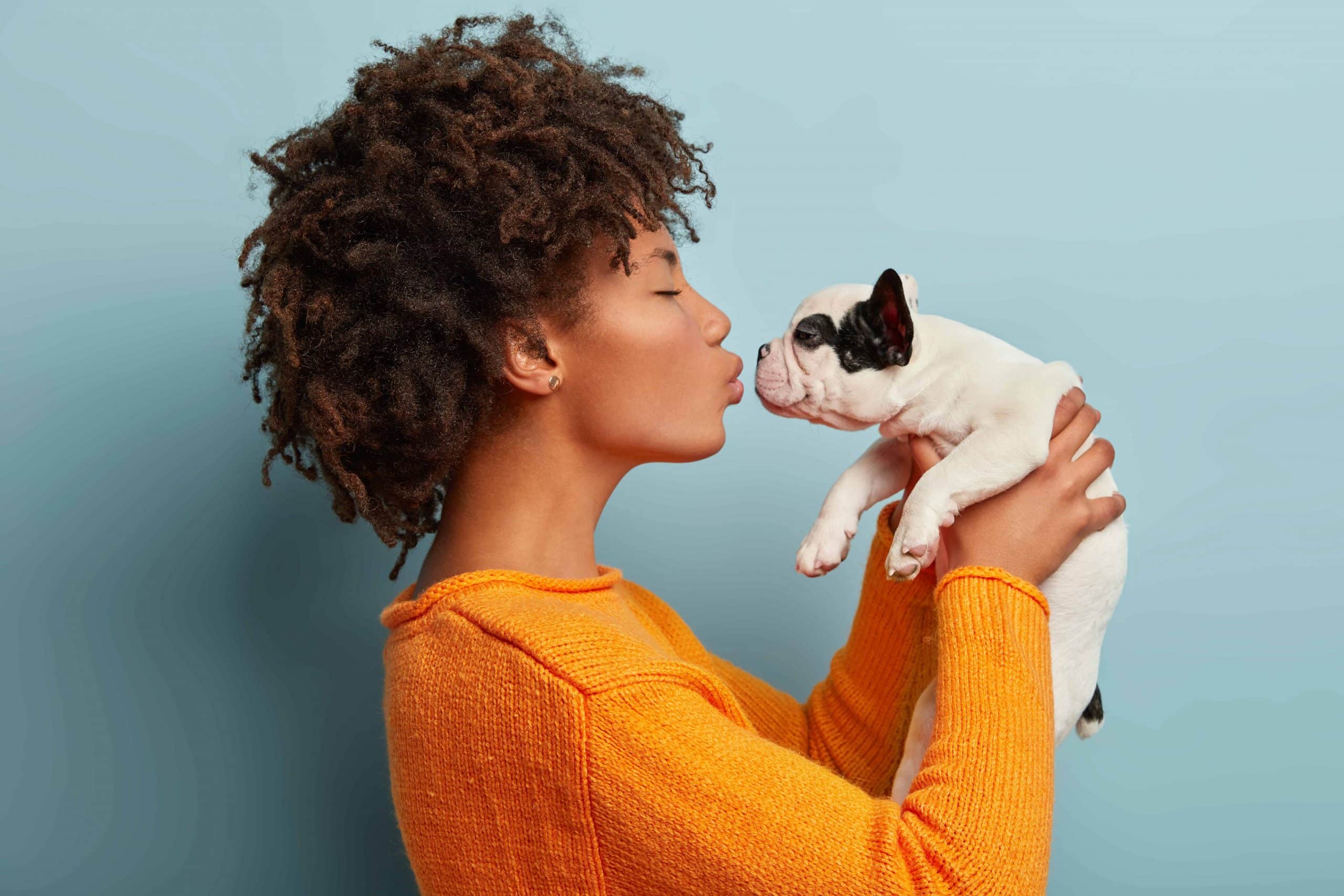 Dog periodontal insurance and girl kissing dog